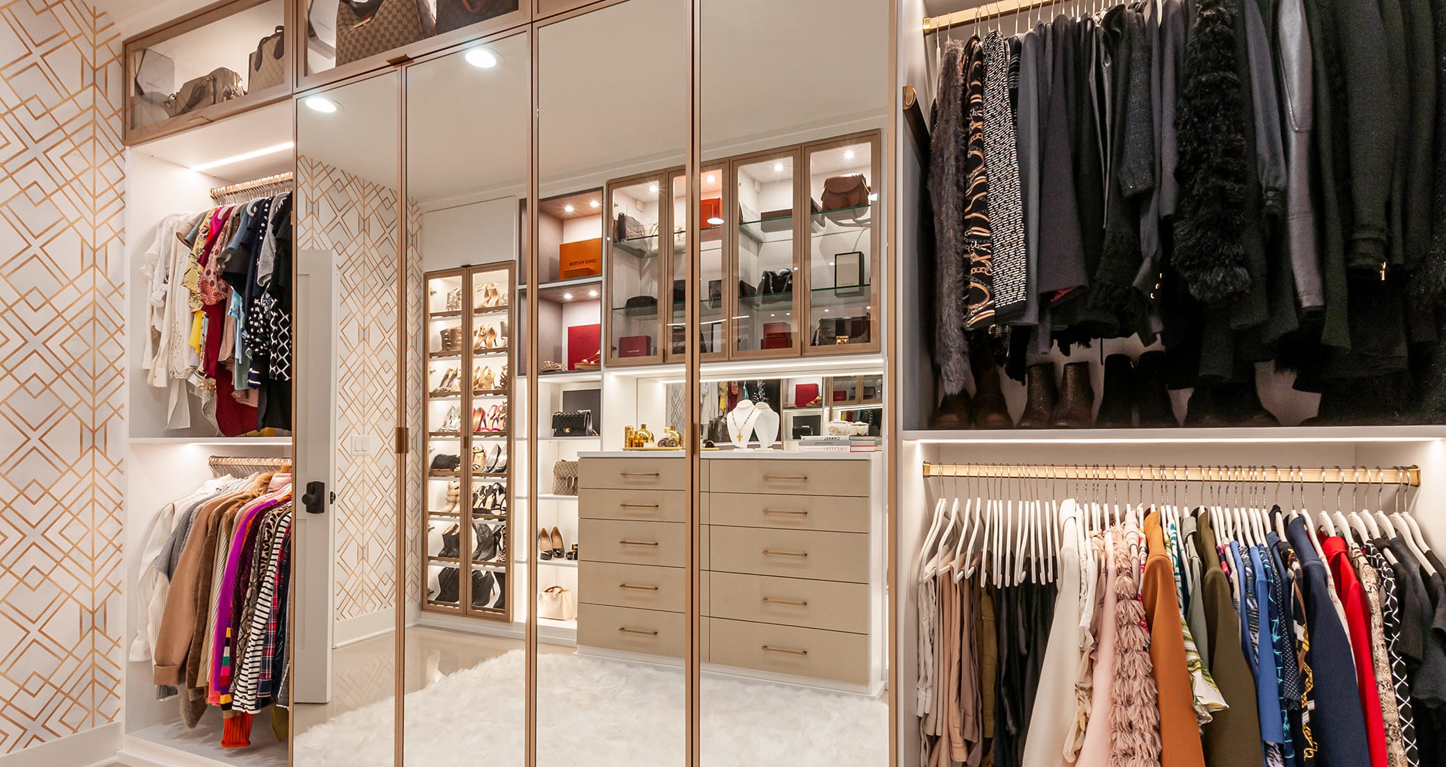 Customized closet for a New Jersey couple with mirrored doors and built in dresser by California Closets