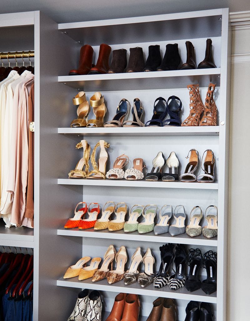Shoe storage and organization in Martha Stewart's walk in closet created by California Closets