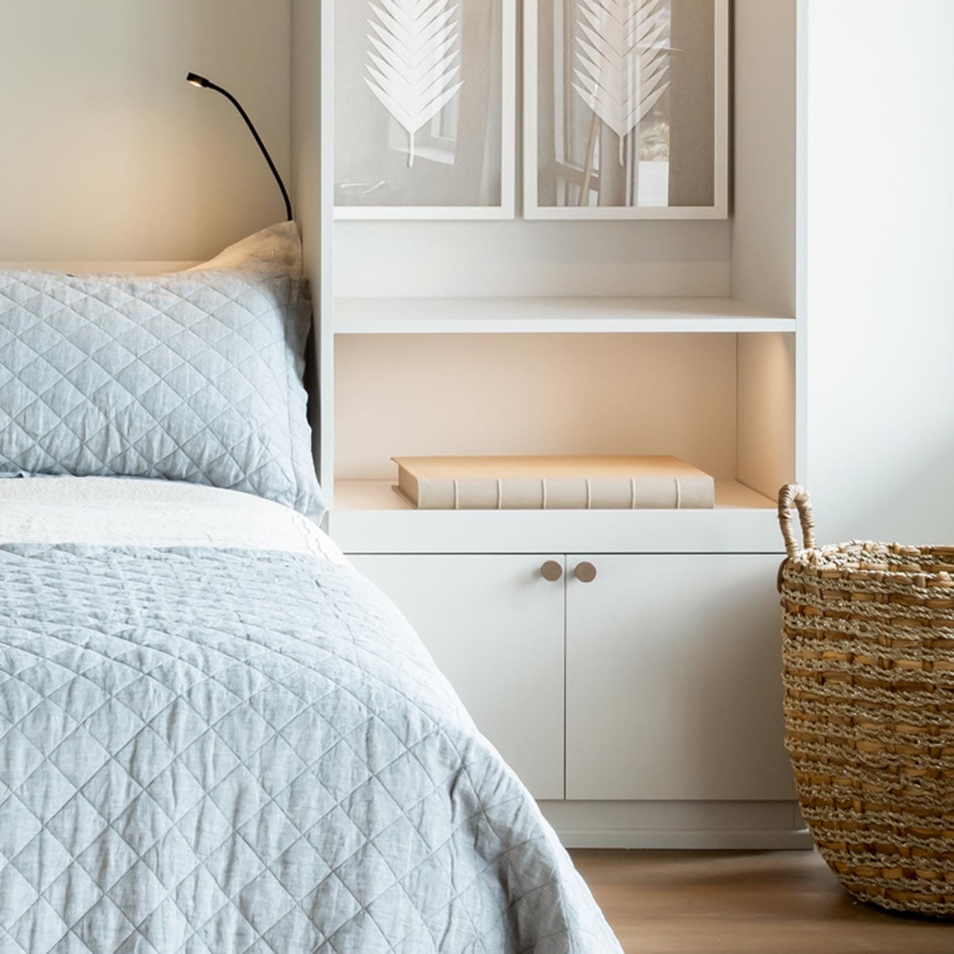 Custom wall bed buil in with pull out shelves and storage space in a white finish by California Closets