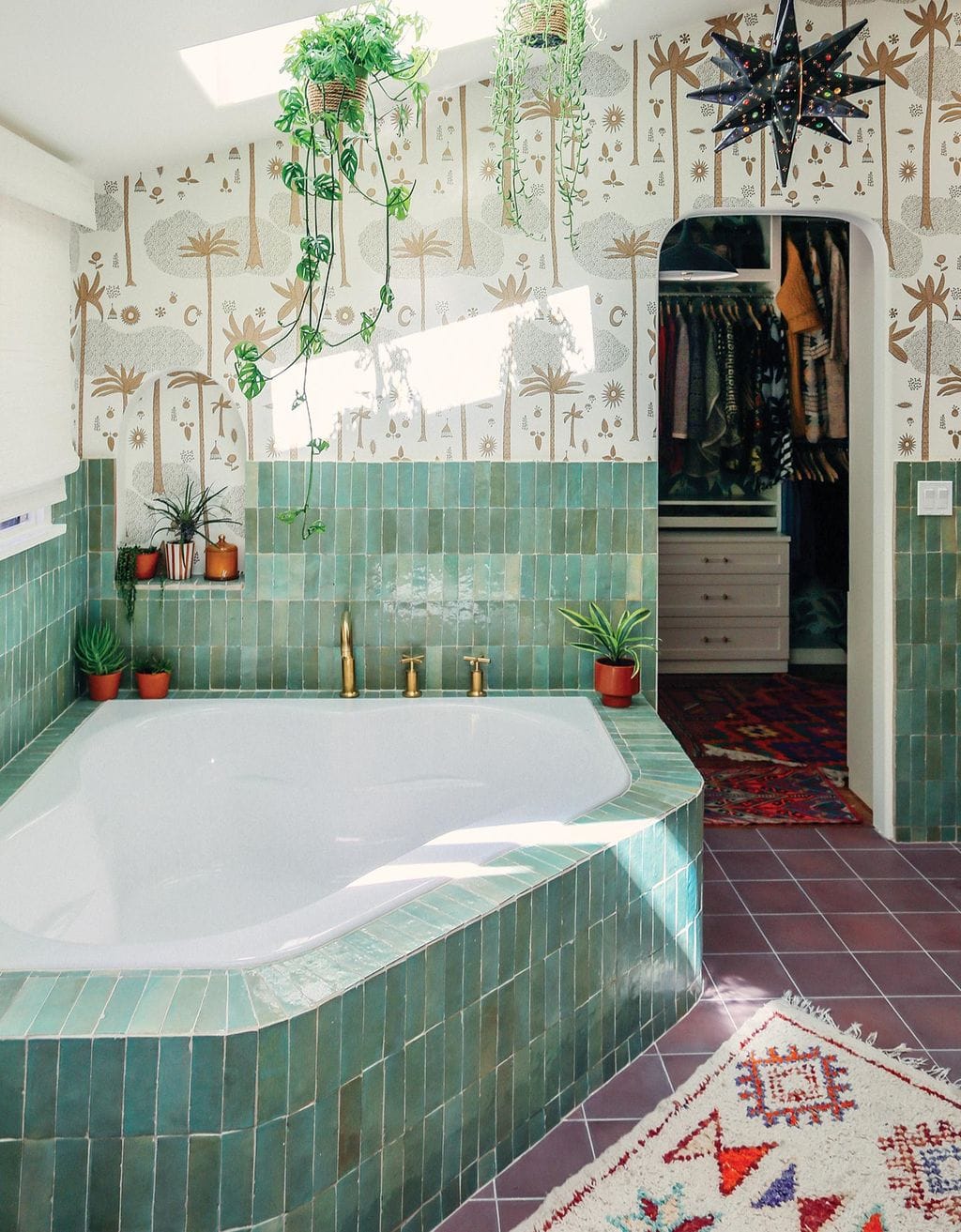 Justina Blakeney's bathroom designed with colorful tile and wallpaper with custom storage in Ideas of Order Magazine